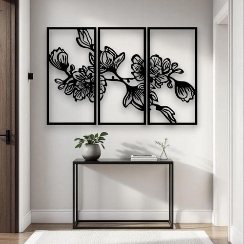 ست سه عددی قاب مستطیلی مشکی فلزی با طرح شکوفههای گل که به صورت افقی بالای یک میز کنسول مدرن نصب شدهاند».