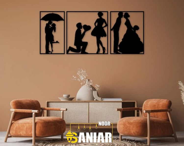 «ست سه تایی قاب فلزی مشکی با طرحهای سیلوئت عاشقانه (قرار زیر چتر، زانو زدن و عروسی)، نصب شده روی دیوار قهوهای روشن بالای یک کنسول مدرن».