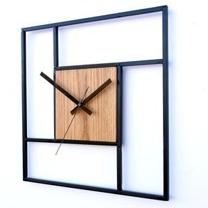 ساعت-دیواری-فلزی-مدرن-طرح-هندسی-مشکی-طرح-چوب-شرکت-سانیار-نور